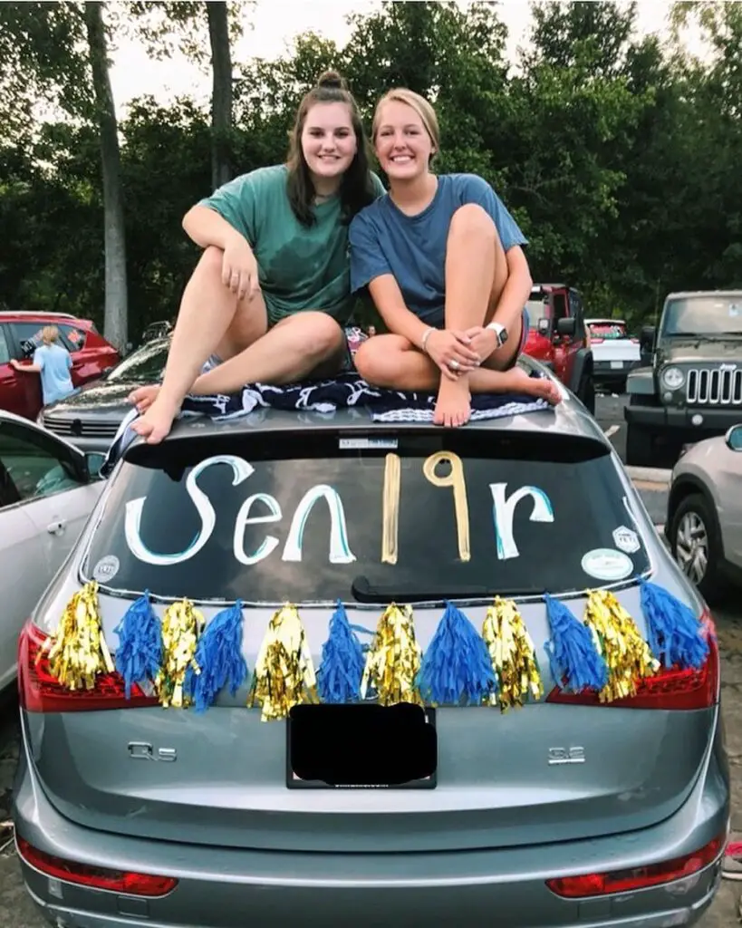 car decorated with blue and gold tassel garland