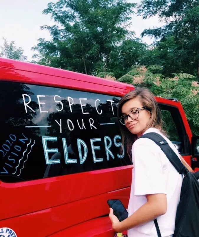 car with the words respect your elders written on the window
