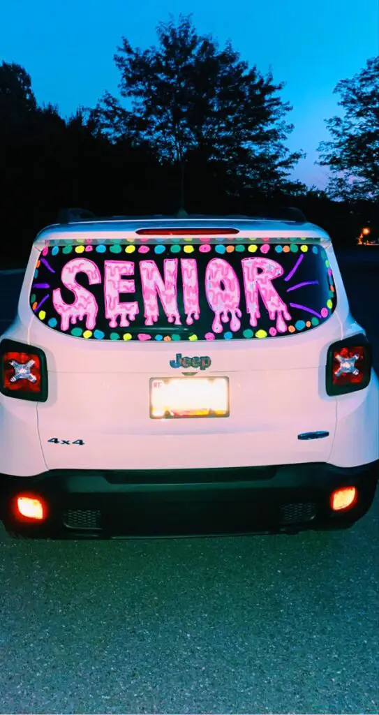 car with the word senior written on the back windshield
